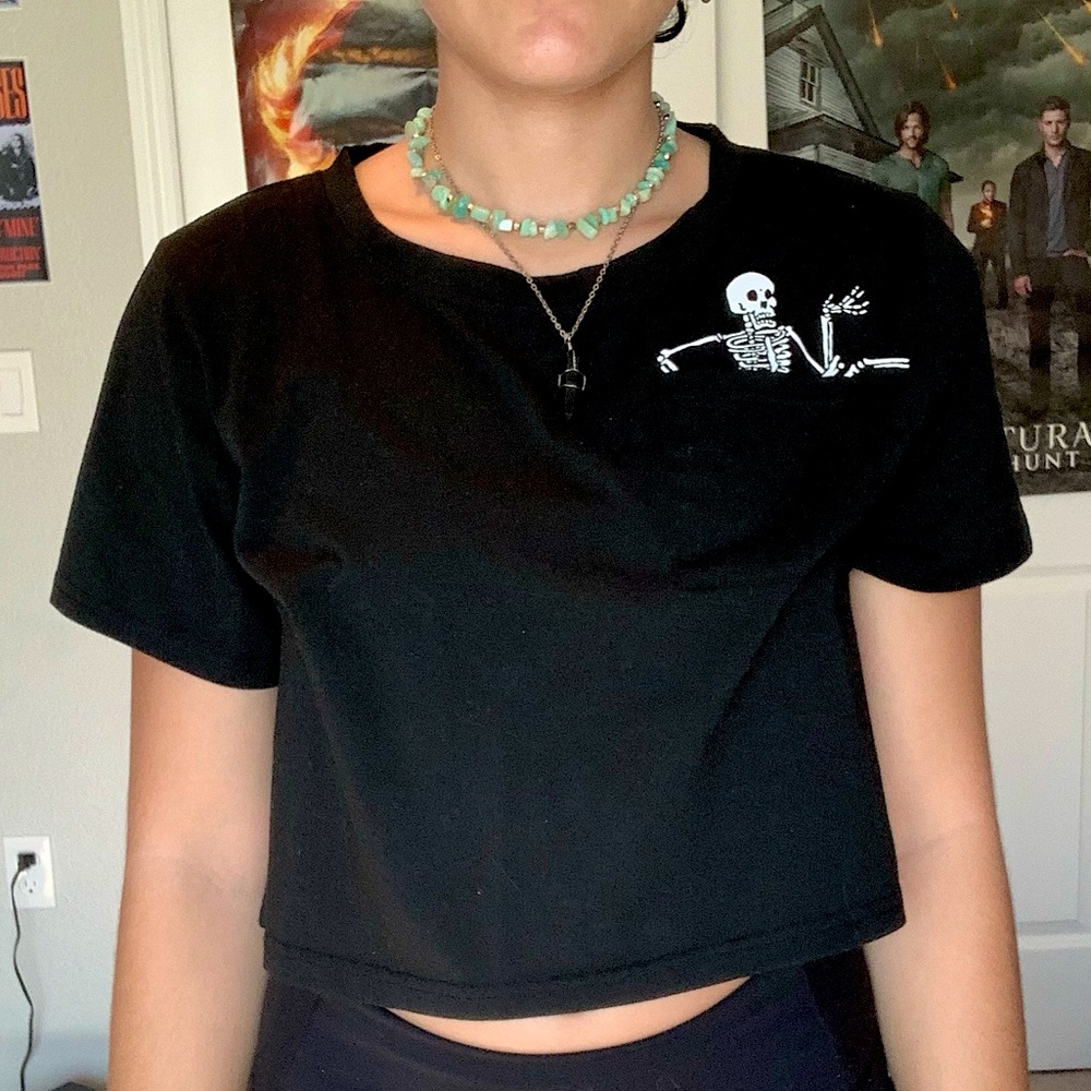 Black crop t-shirt with skeleton pocket
